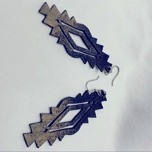 Black leather and gold earrings handmade in South Africa.